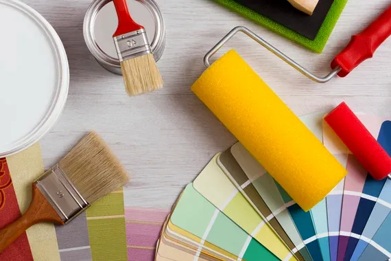 Brushes, rollers and color swatches ready for a job
